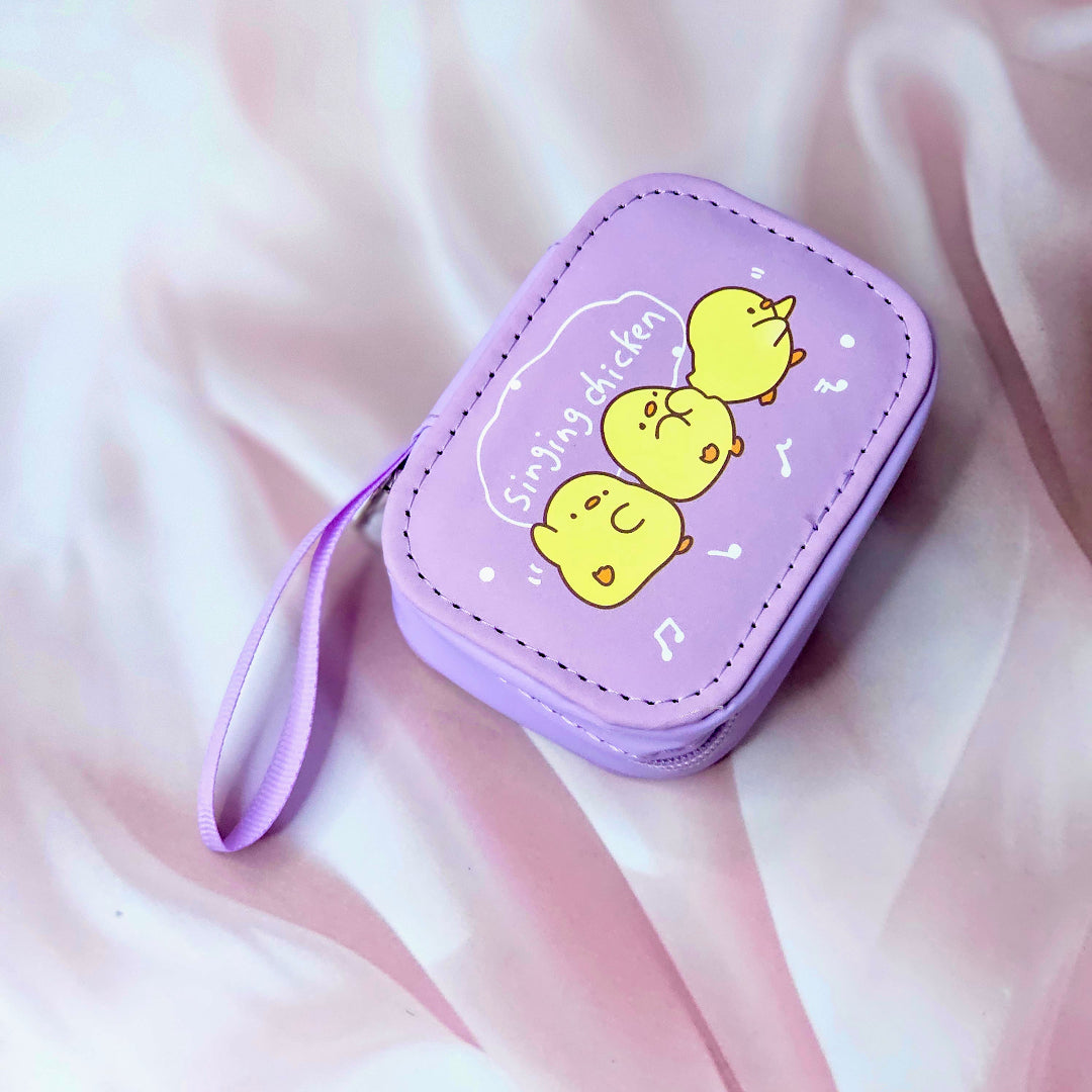Assorted cute cartoon small storage coin pouches for kids in pink and purple with animal characters. www.usmile.toys